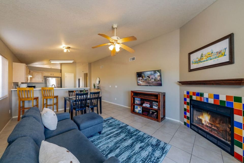 Additional living room space with smart TV leads into kitchen (note: fireplace is currently non-functional)