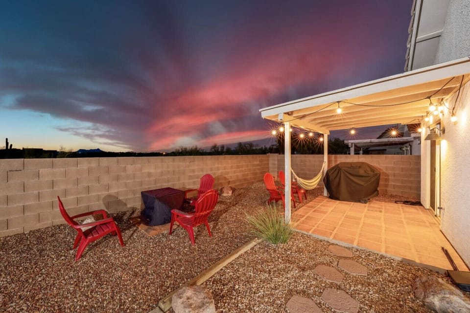 Backyard with propane fire pit, covered back patio, hammock, and new gas grill (and a perfect example of Tucson`s stunning sunsets)