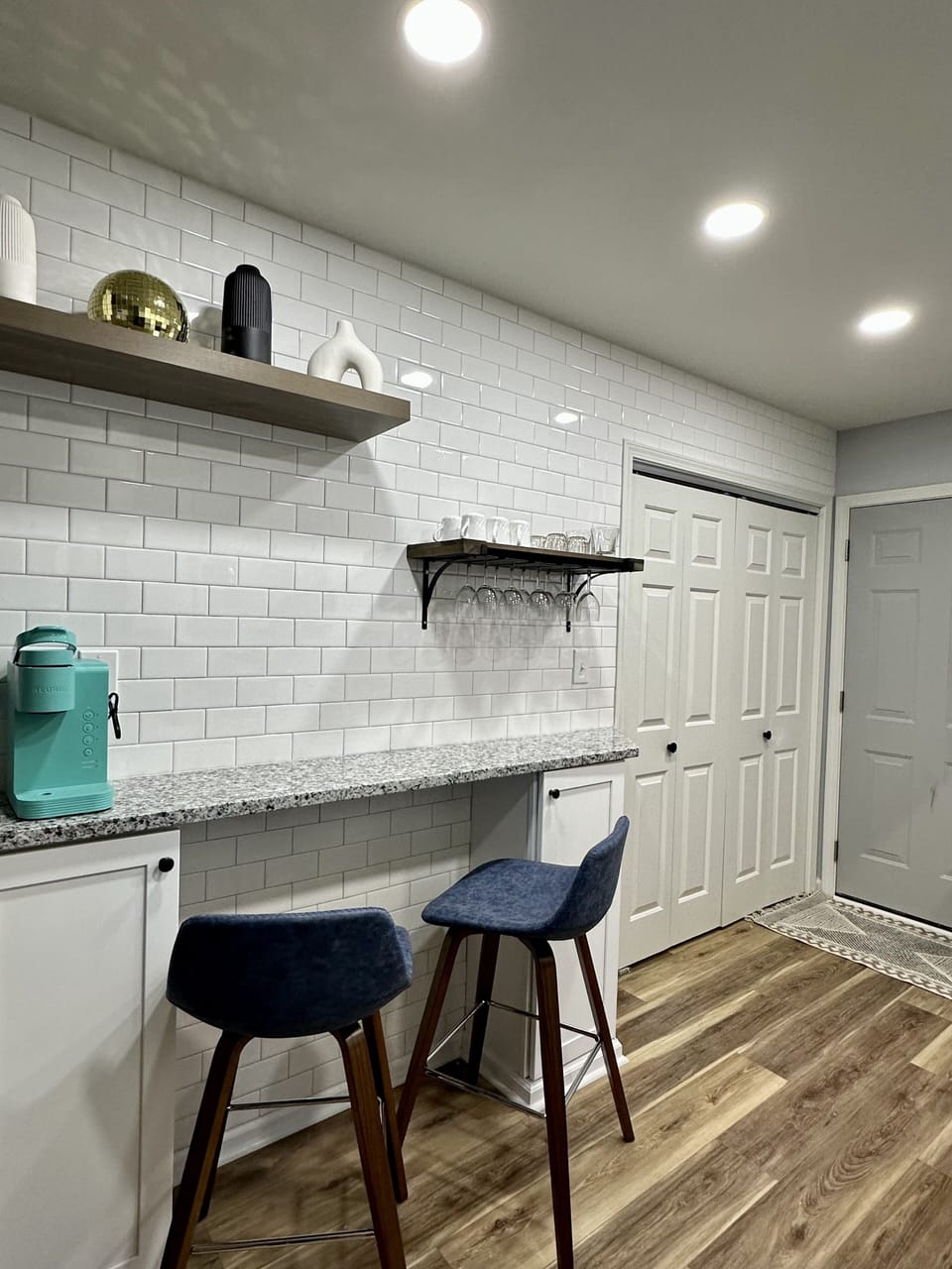 Coffee/wine bar with subway tiles, Keurig coffee maker & wine glasses