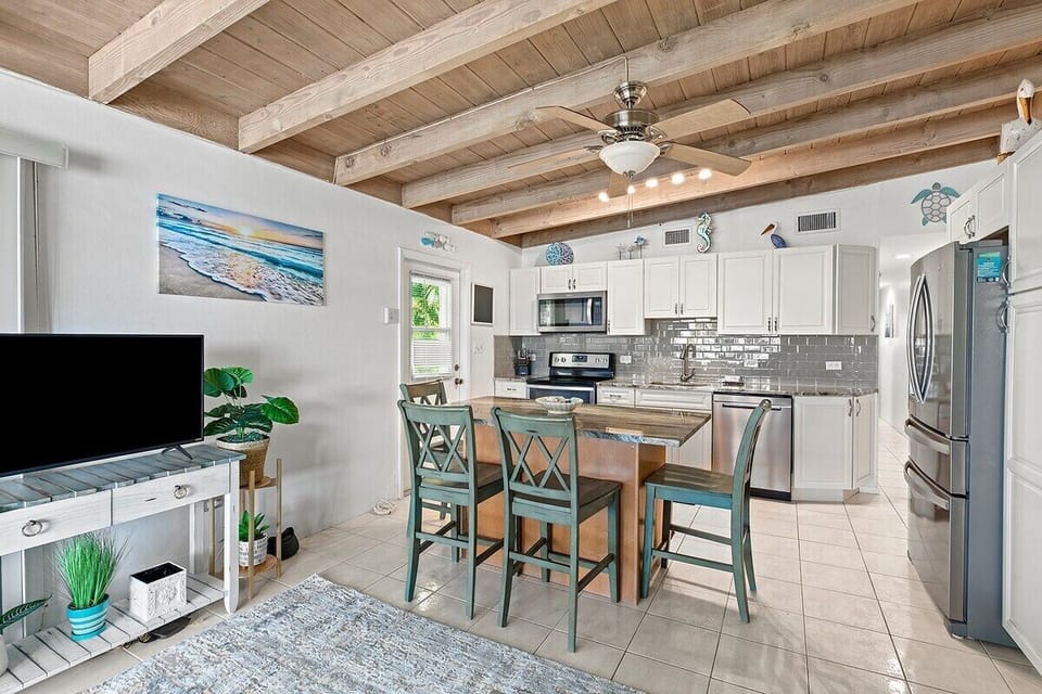 Enjoy an inviting open layout that connects the living room, dining space, and fully equipped kitchen.