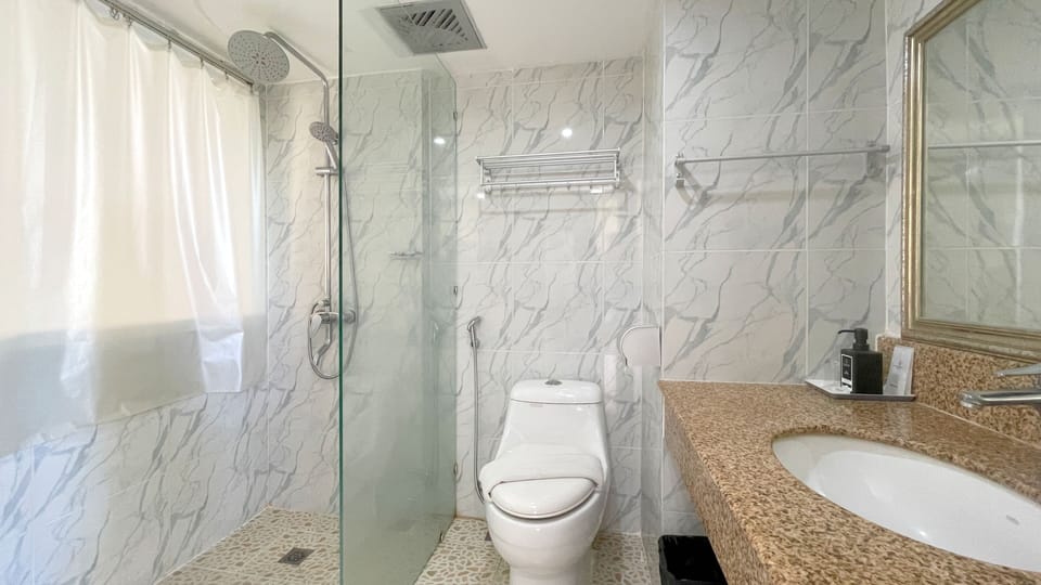 Deluxe Room, 2 Twin Beds, Pool View | Bathroom | Shower, free toiletries, hair dryer, towels