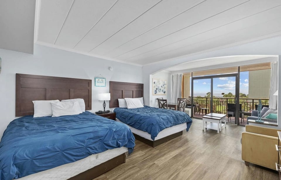 Comfortable two queen beds with freshly laundered linens provided