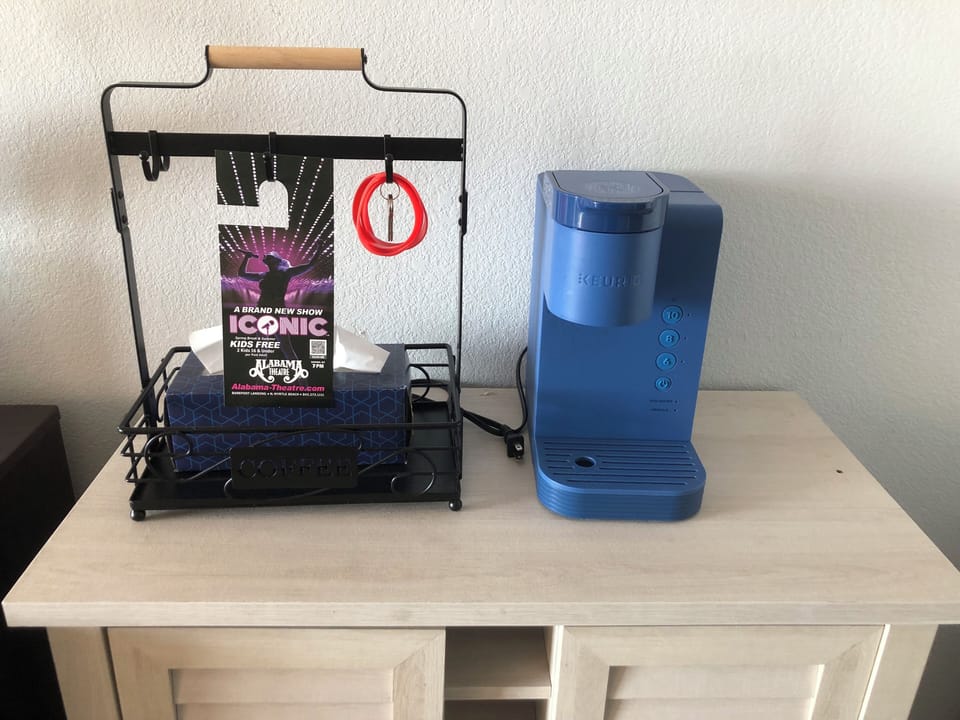 Coffee maker, parking tags, and wristbands included.