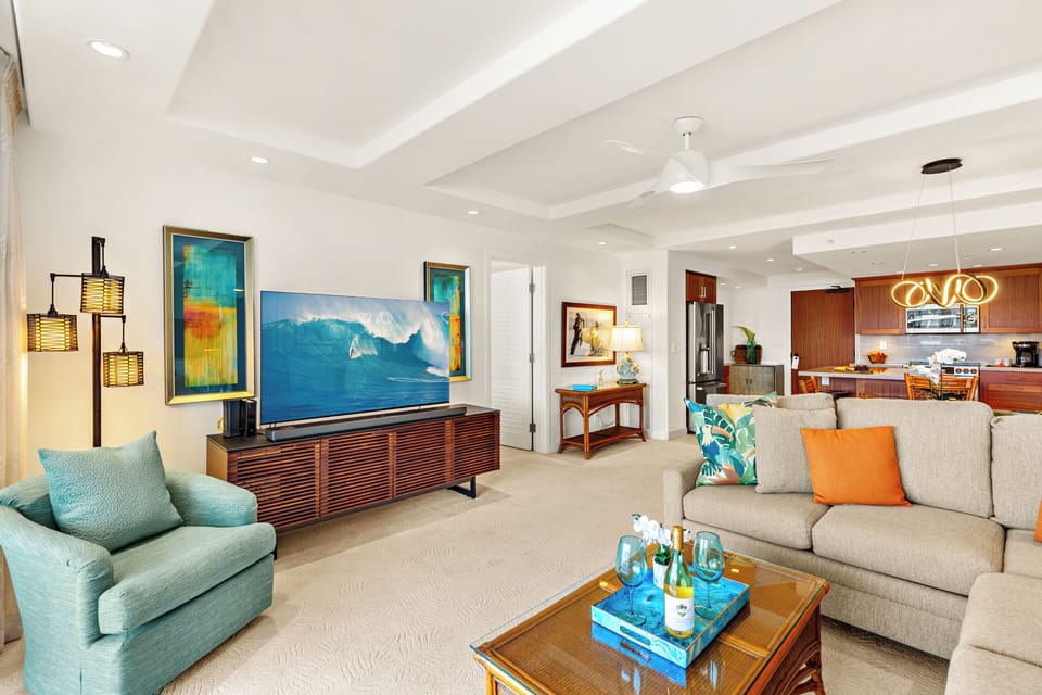 Unwind in a bright and welcoming living area, complete with a flat-screen TV and comfortable furnishings. Perfect for peaceful evenings in.