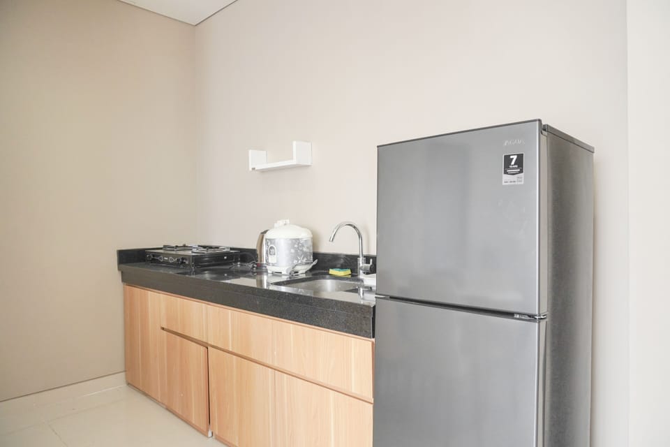Apartment | Private kitchen | Full-size fridge, stovetop, dining tables
