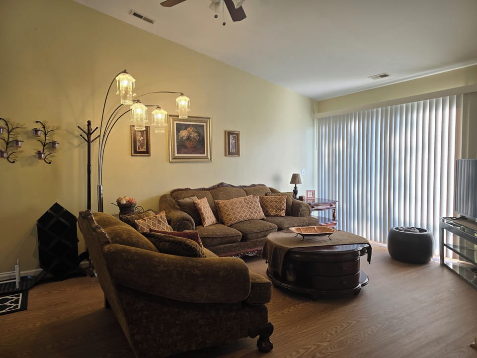 Living Room: Spacious living area with comfortable seating for 7