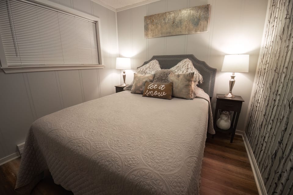 Cozy queen size bed.