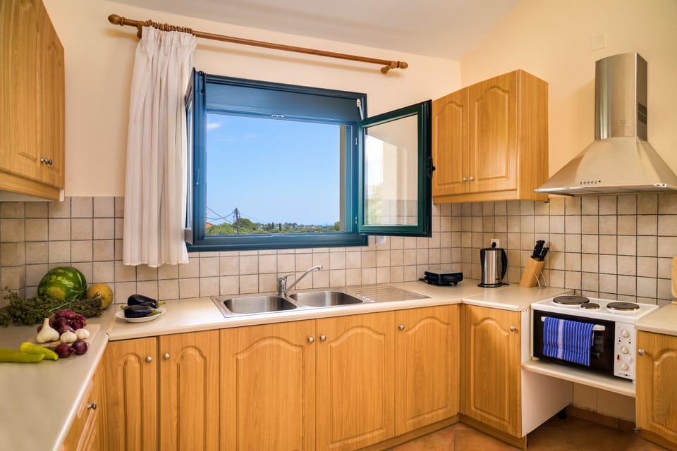 Apartment, Sea View | Private kitchen | Full-size fridge, microwave, oven, stovetop