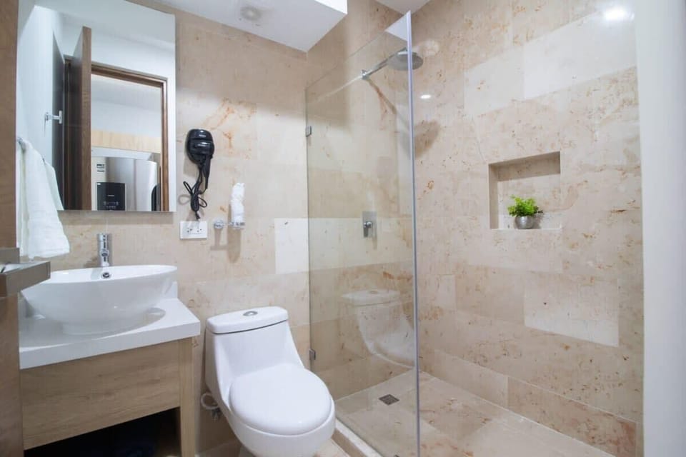 The full bath has modern installations and a walk-in shower