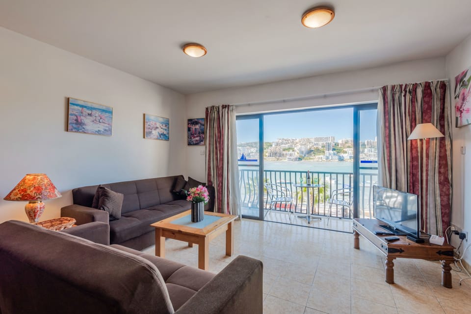 Standard Apartment, 2 Bedrooms, Sea View | Living area | Flat-screen TV