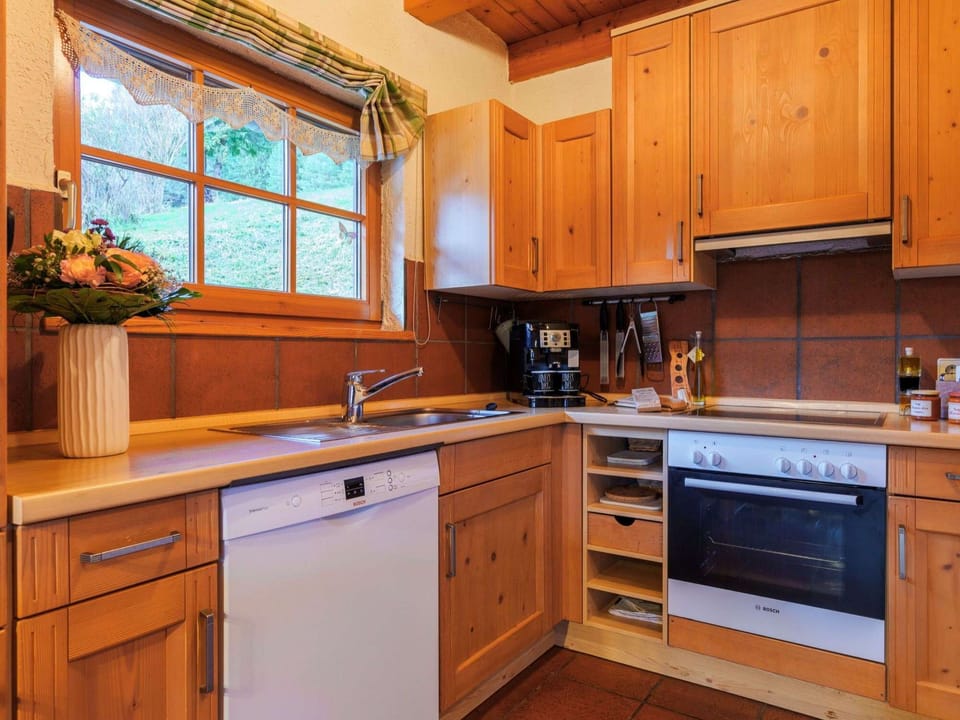 Kitchen with oven and microwave