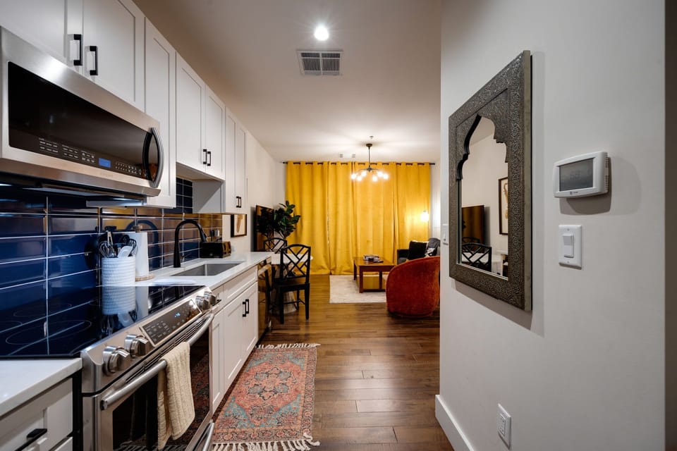 Infuse your cooking adventures with joy in this welcoming yellow kitchen, radiating warmth and happiness. Elevate your culinary experience in a space that adds a splash of cheer to every meal!