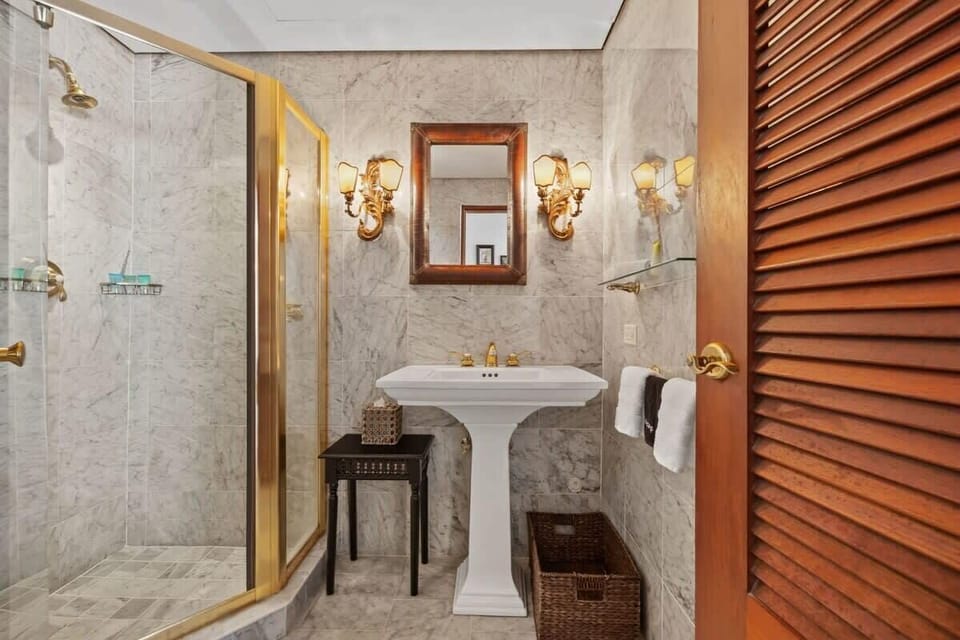 The bathroom at the first level of the villa. It is a full bathroom with shower.