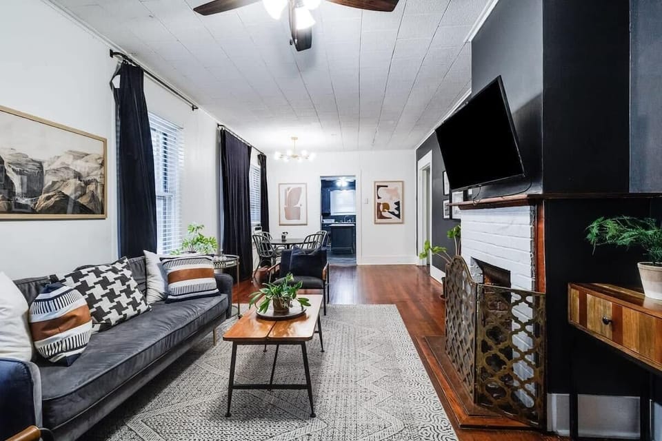 Bright and comfortable living space with plush seating — perfect for relaxing after a day in Cajun Country.