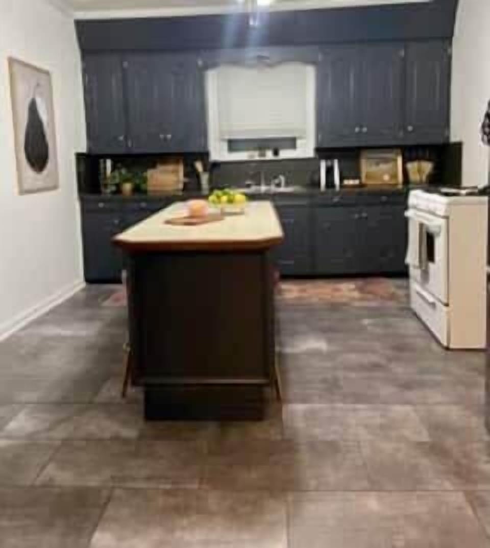 Fully equipped kitchen with modern appliances and cookware for home-style meals.