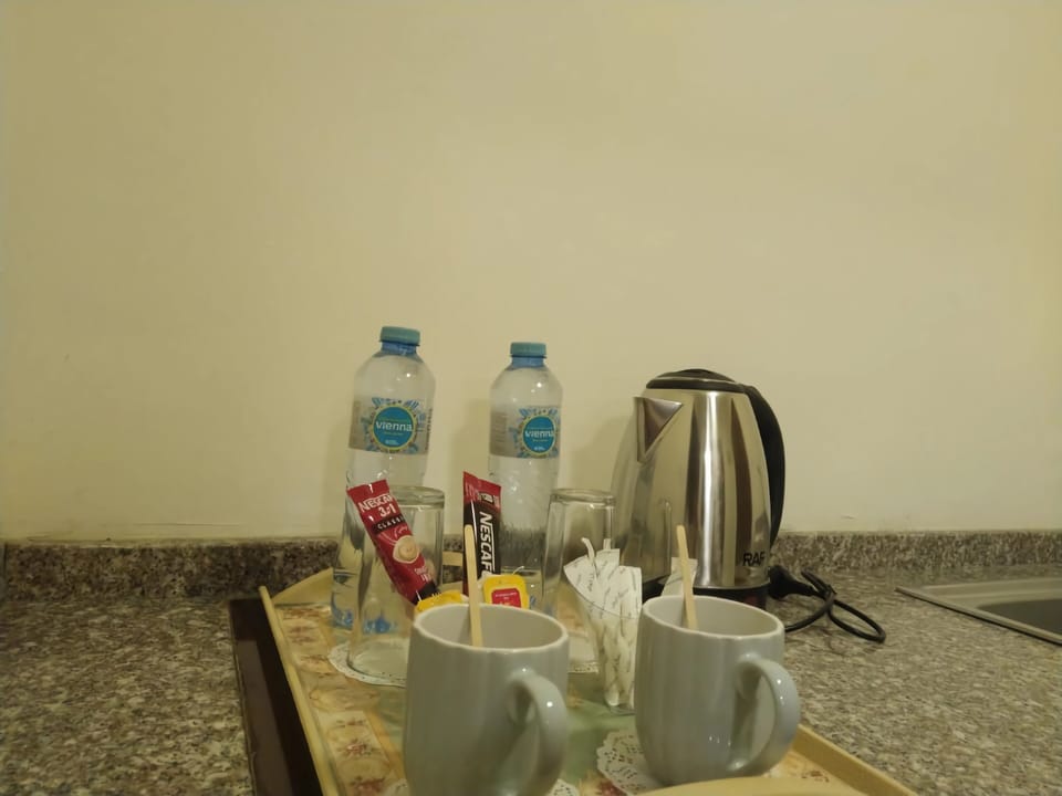 Coffee/tea maker, mini-fridge, shared microwave, electric kettle
