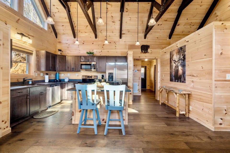 Bright rustic kitchen with vaulted ceilings and cozy cabin charm