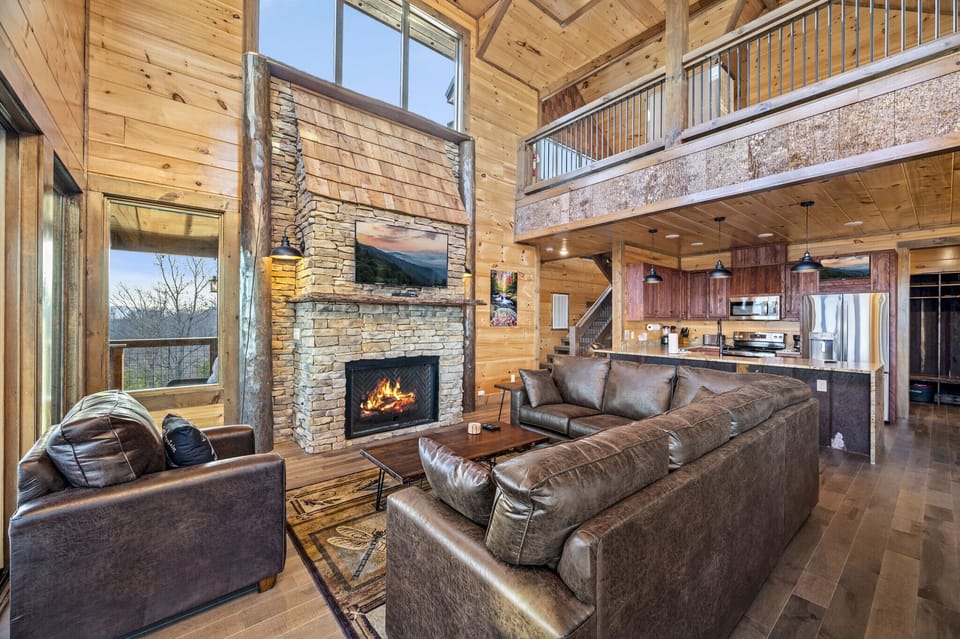Gas fireplace in great room with open plan