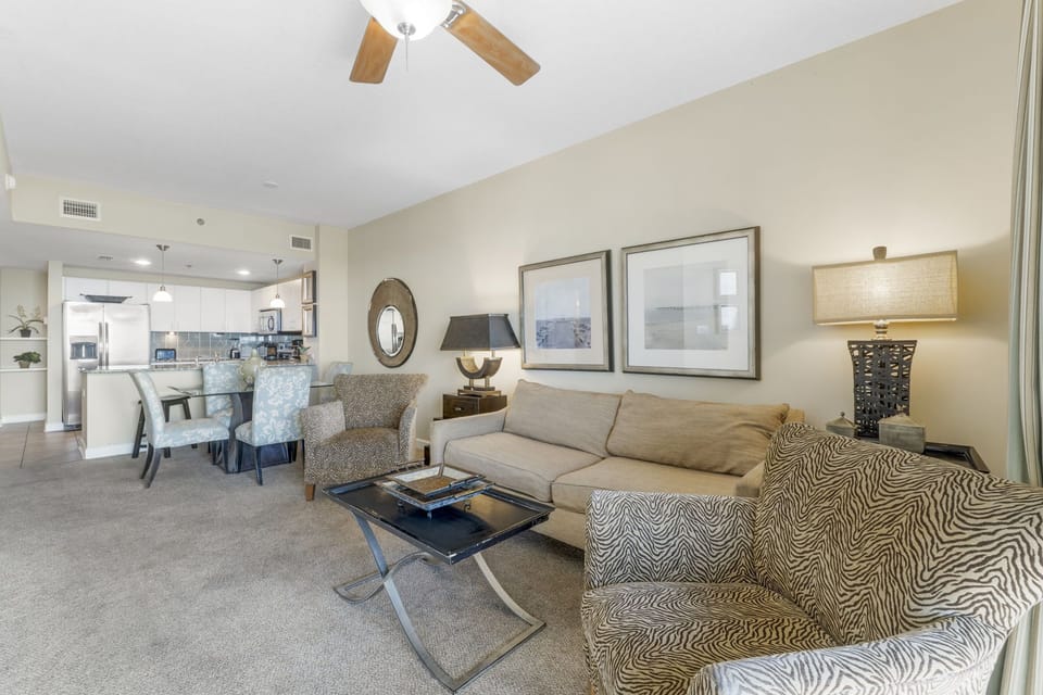 Spacious living area with comfortable seating and an open kitchen layout