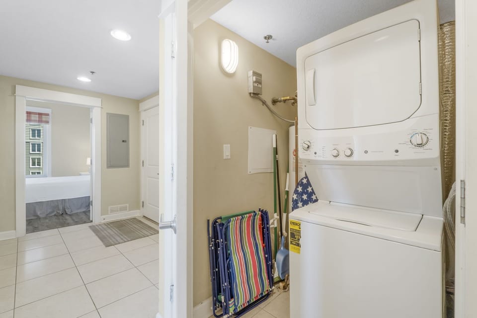 Compact laundry area with stacked washer and dryer for convenience.