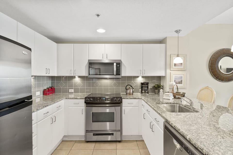 modern kitchen with stainless steel appliances and granite countertops