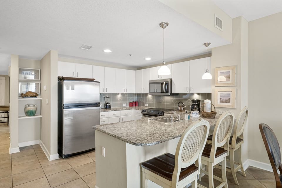 Modern kitchen with granite countertops and stainless steel appliances