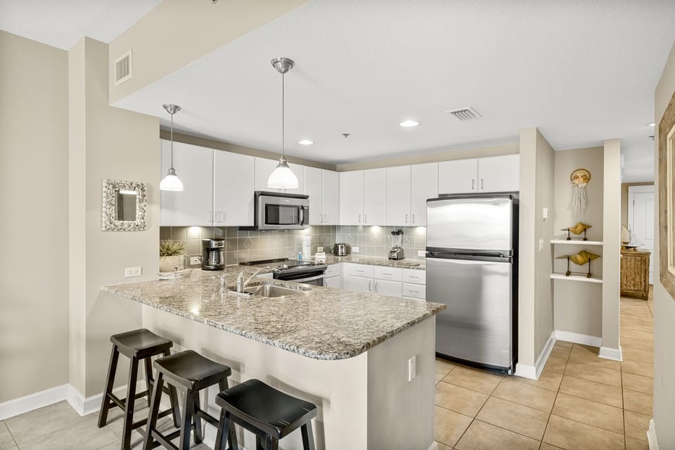 Modern kitchen with granite countertops and stainless steel appliances