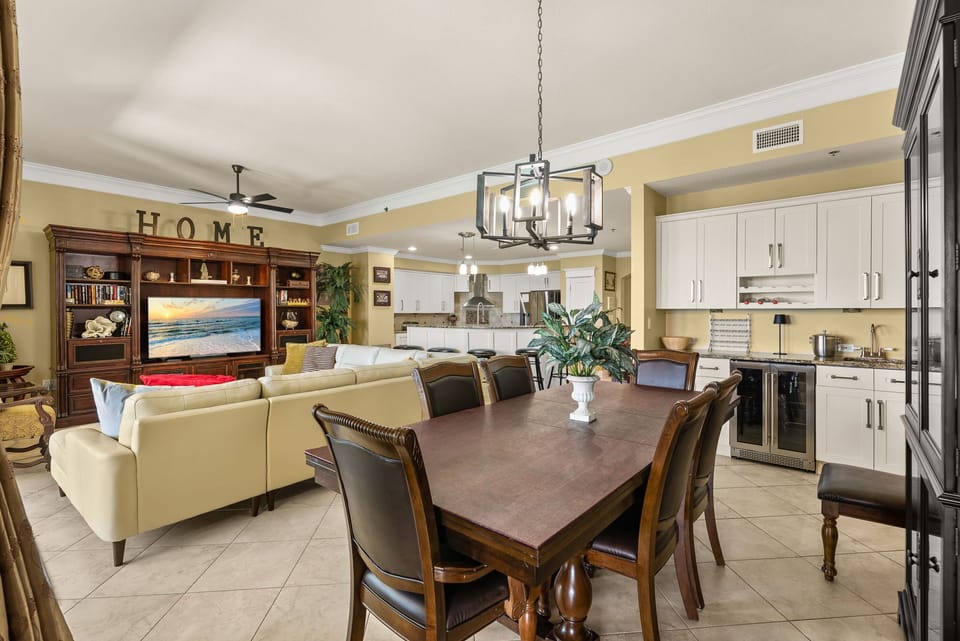 Open-concept living and dining area with classic wooden furniture and a cozy atmosphere.