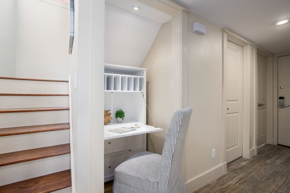 Your bright workspace awaits with built-in desk and chair, perfect for catching up on emails or planning adventures.