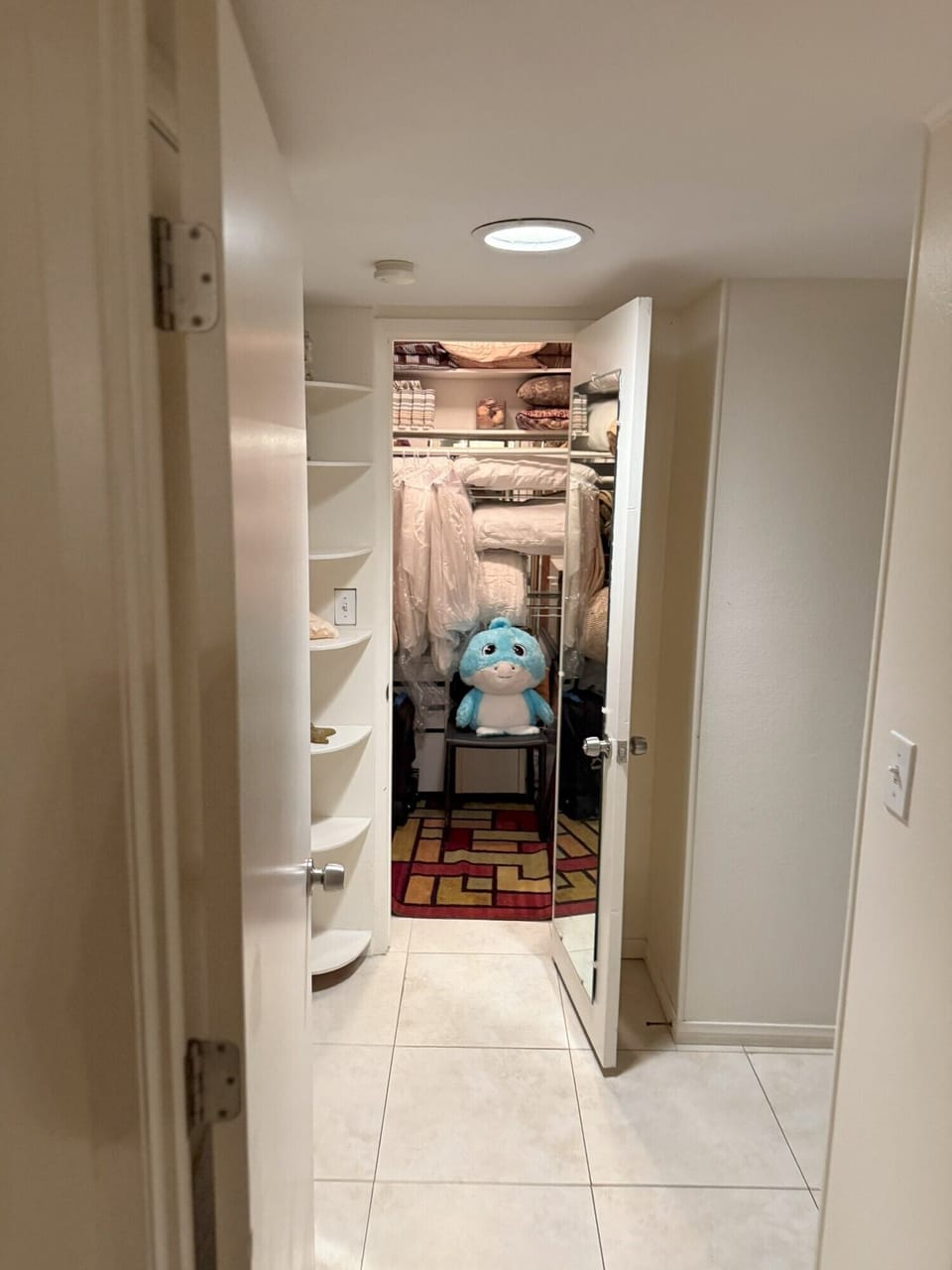 Extra closet with fresh and clean bedspreads (cursed blue stuffie not included)