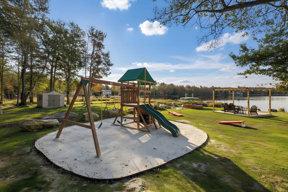 The kids swing set and yard area