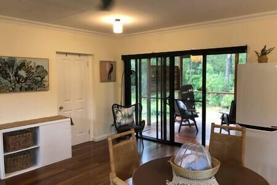 Spacious bungalow and large covered deck nestled near the bush.