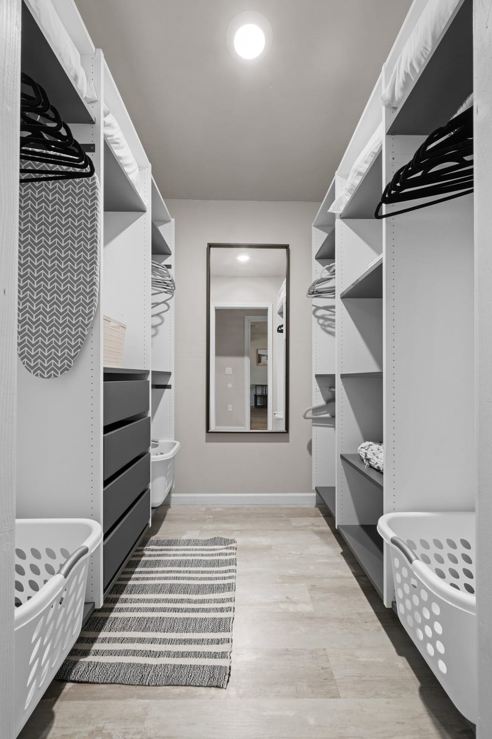 Step into your dream wardrobe with this spacious, elegantly designed closet—where style meets organization.