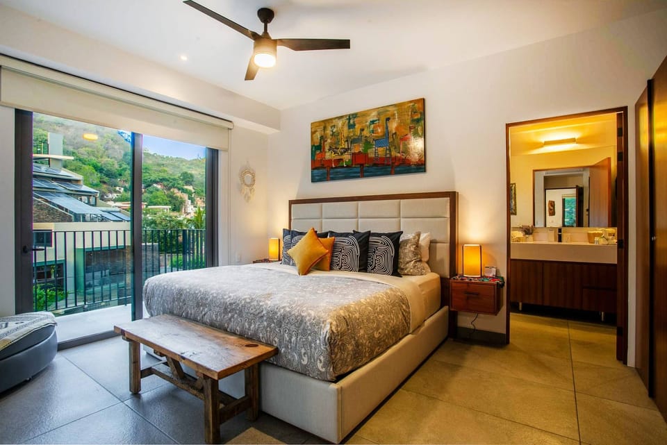 The comfortable master bedroom has a king size bed, ensuite bathroom and ample closet space