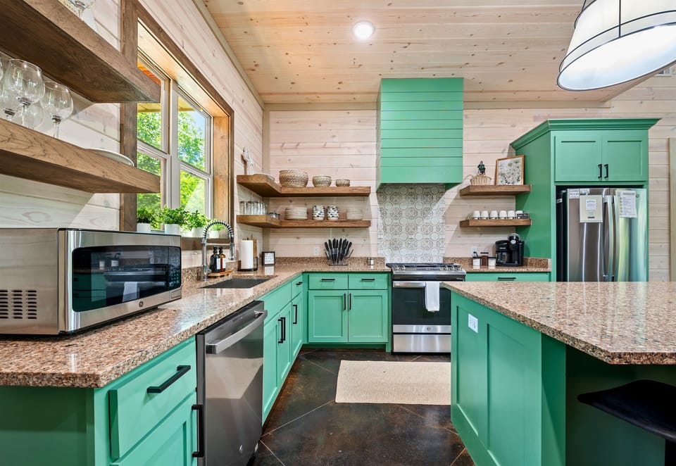 The bright and cheerful kitchen blends vintage charm with modern conveniences, making meal preparation a joy.