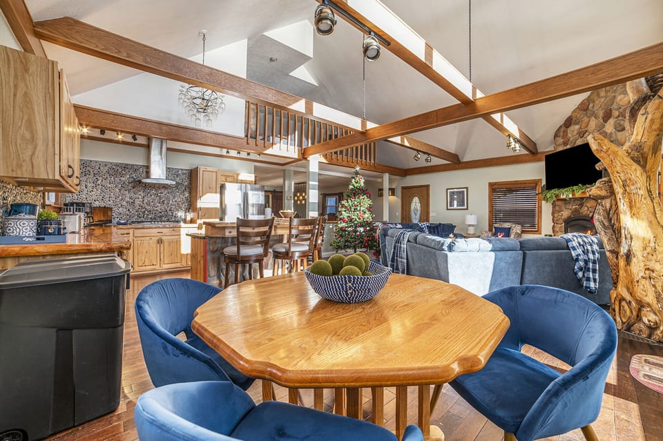 The Breakfast table with comfy chairs next to kitchen and living room