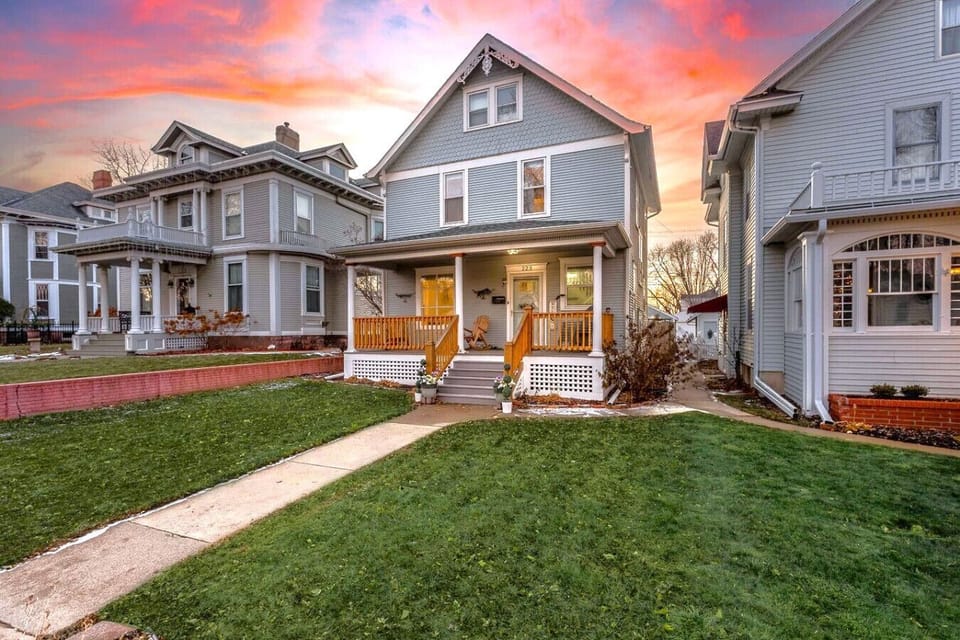 Charming front porch with sunset views and cozy seating.