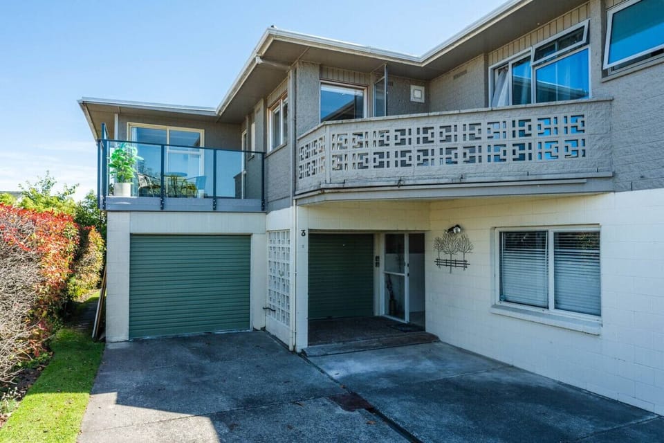 Parking for 2 vehicles in front of the left hand side garage. The parking on the right is for the apartment upstairs