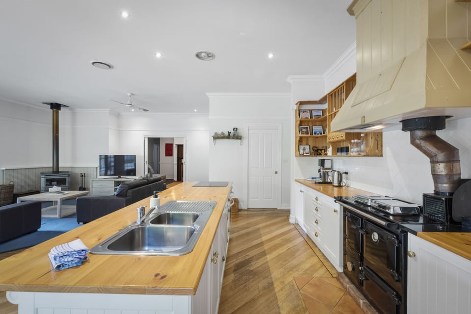 Deluxe House | Private kitchen | Espresso maker, coffee/tea maker, full-size fridge, microwave