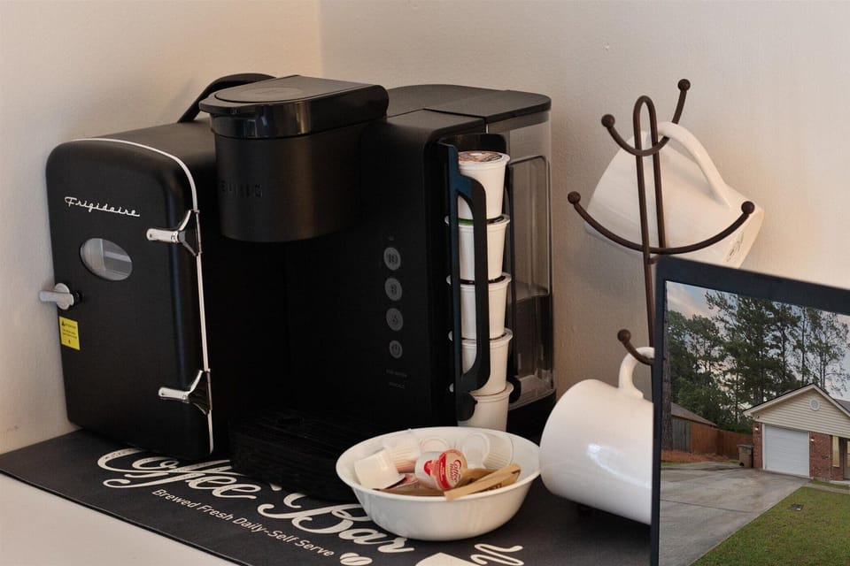Private coffee bar and mini-fridge in the master bedroom.