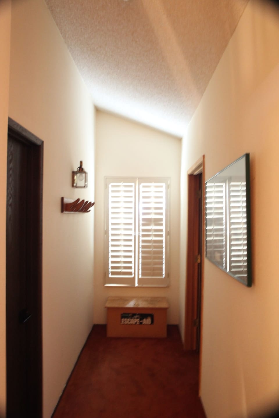 Hallway to bedroom and bathroom off of loft area
