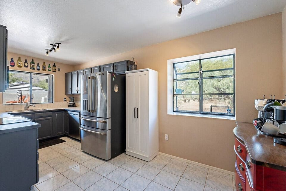 Well-appointed kitchen with plenty of natural light and views of the backyard