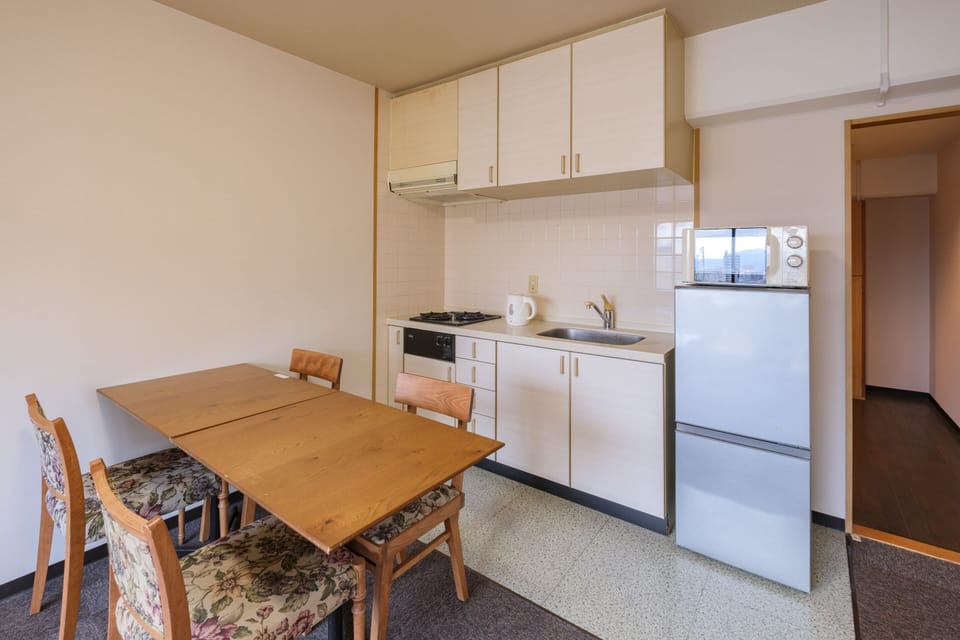 Junior Suite Room (2 Small Double Beds) with Kitchen - Non-Smoking - Cleaning Fee Extra | Private kitchen | Mini-fridge