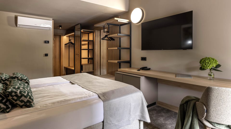 Premium family room | Minibar, in-room safe, desk, free WiFi