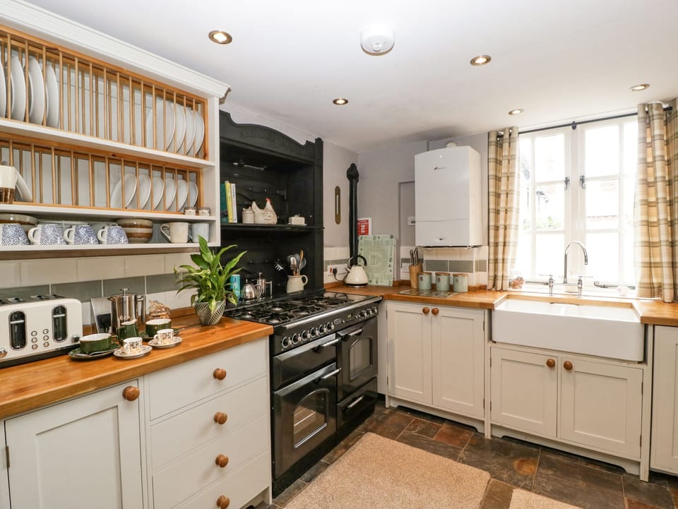 Fridge, electric kettle, toaster, cookware/dishes/utensils