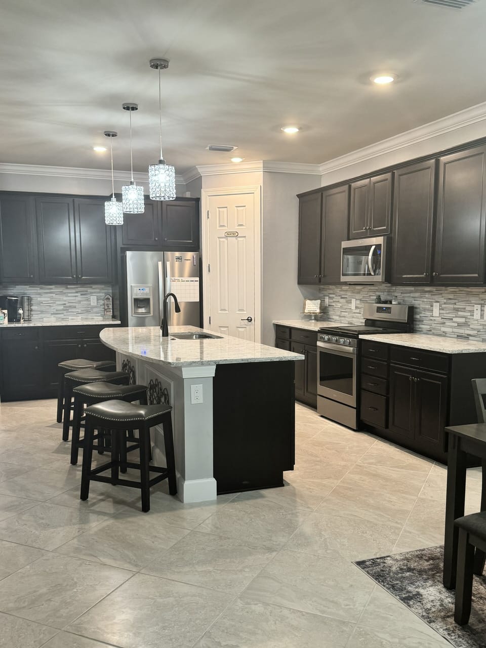 Fully stocked with dishes, Keurig, air fryer, crockpot, blender.