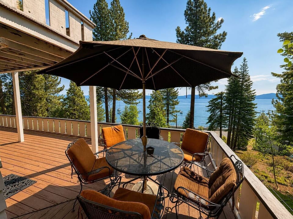Outdoor dining and lounge space with stunning water views.