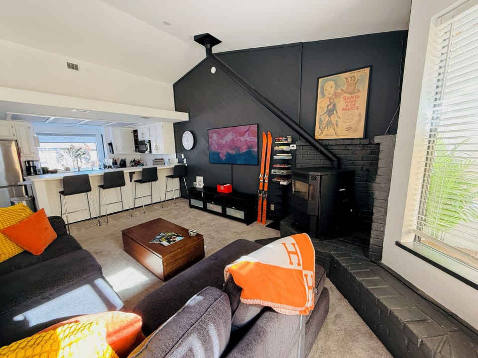 Open plan living room/kitchen gives the space a lofty feel while still cozy.