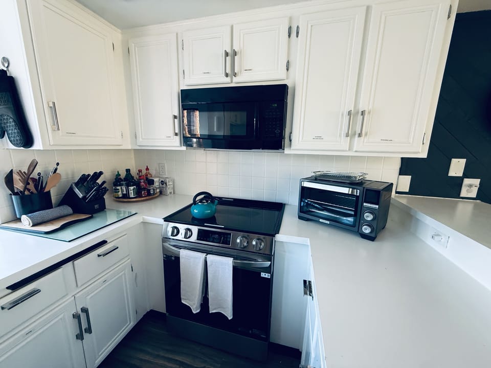 Recently renovated kitchen featuring new appliances. 