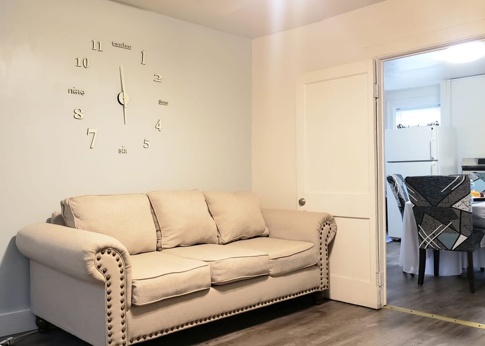 Living room - complete with illuminated glow-in-the-dark, accent wall clock & TV